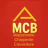 M C B